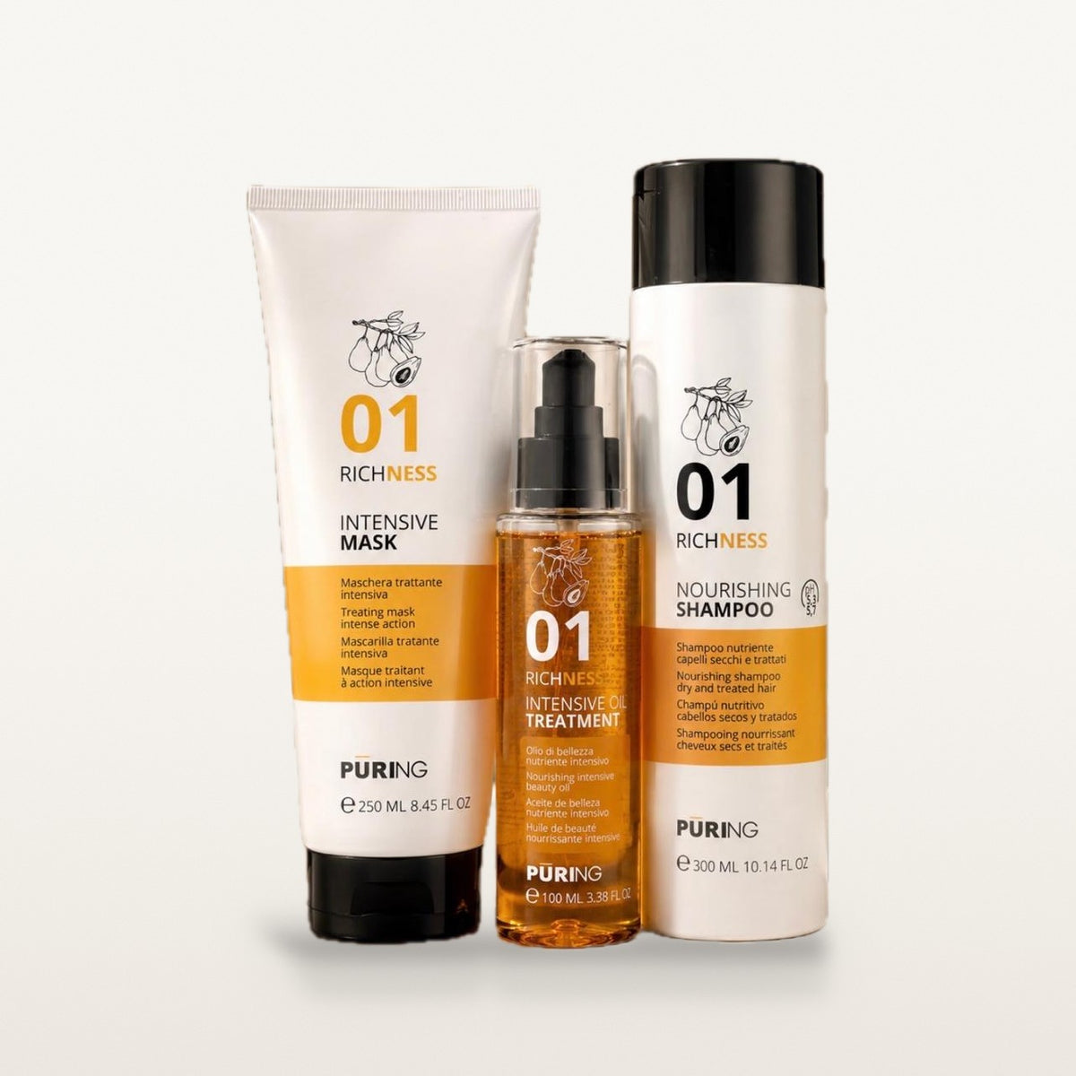 Coffret nutrition 01 : tube de masque 250 ml, flacon d'huile 100 ml et flacon de shampooing 300 ml, sur fond crème